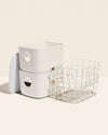 Two Open Spaces Cream Medium Storage Bins with plastic lids and Two Cream Medium Storage baskets on a cream background.