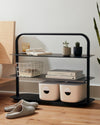 The Open Spaces Black Entryway Rack on a grayish background.