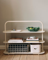 The Open Spaces Cream Entryway Rack on a cream background with items displayed on it.