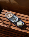 Top view of the Open Spaces Navy Nesting Tray with keys and other items on a wooden surface.