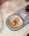 Close up of the Open Spaces Navy Nesting Tray with decorative items on it. 