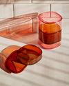 The Amber & Light Pink 2-piece Storage gems on a tiled background. 