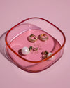 The Amber & Light Pink Storage gems with jewellery stored in it on a white background. 