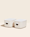 Two Open Spaces Medium Cream Storage Bins with plastic lids on a cream background. 