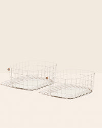 The Opens Spaces Large Cream Wire Baskets on a cream background. 
