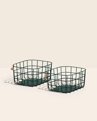 Two Open Spaces Dark Green Medium wire basket on a cream background. 