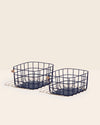 Two Open Spaces Navy Medium wire basket on a cream background. 