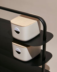 Close up of the Black Entryway Rack Bundle with two cream Strorage Bins with Wooden lids 