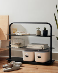 OS Black Entryway Rack used in a living room.