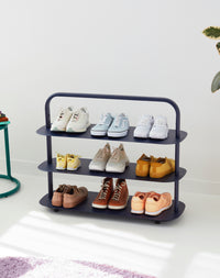 OS Navy Entryway Rack used in a living room.